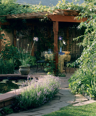 A grape arbor-patio can provide a sheltering space in nature to enjoy a leisurely breakfast, a romantic dinner, or coffee with a friend.